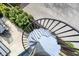 Outdoor spiral staircase with foliage and backyard views at 1238 Alabama St, Indianapolis, IN 46202
