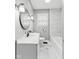 Bathroom featuring a modern vanity, a round mirror, and a shower/tub combo with stylish tile at 1241 Brandt Dr, Indianapolis, IN 46241