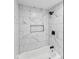 Bathroom showcasing a modern shower/tub combo with black hardware, white tile, and a built-in niche at 1241 Brandt Dr, Indianapolis, IN 46241