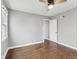 Bedroom with hardwood floors, neutral gray walls and trim, ceiling fan and closets for storage at 1241 Brandt Dr, Indianapolis, IN 46241