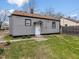 Back of charming home with a well-maintained lawn and quaint design at 1241 Brandt Dr, Indianapolis, IN 46241