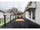 Inviting back deck area with black chairs and a patterned outdoor rug, great for relaxation at 1252 Kappes St, Indianapolis, IN 46221