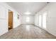 Expansive finished basement area with tile floors, white wainscoting, and natural light at 1252 Kappes St, Indianapolis, IN 46221