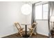 Cozy nook with small table, hardwood floors and natural light from the window at 1252 Kappes St, Indianapolis, IN 46221