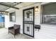 Close-up of front door and covered porch with stylish exterior lighting at 1252 Kappes St, Indianapolis, IN 46221