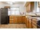 Functional kitchen featuring wood cabinets and modern appliances at 1252 Kappes St, Indianapolis, IN 46221