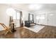 Well-lit living room with a leather sofa, hardwood floors, and decorative lighting at 1252 Kappes St, Indianapolis, IN 46221
