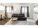 Cozy living room features hardwood floors, contemporary decor and natural lighting at 1252 Kappes St, Indianapolis, IN 46221