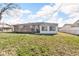 Features a spacious backyard with a deck and sunroom, ideal for outdoor relaxation and entertainment at 1330 N Gibson Ave, Indianapolis, IN 46219