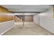 Spacious unfinished basement with concrete floor offers potential for customization and additional living space at 1330 N Gibson Ave, Indianapolis, IN 46219