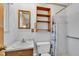 Cozy bathroom with a single sink, toilet, and shower with a lighthouse themed shower curtain at 1330 N Gibson Ave, Indianapolis, IN 46219