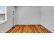 Bright bedroom with beautiful hardwood floors and plenty of natural light at 1330 N Gibson Ave, Indianapolis, IN 46219