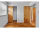 Well-lit bedroom features hardwood flooring and neutral color at 1330 N Gibson Ave, Indianapolis, IN 46219