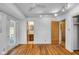 Spacious bedroom with hardwood floors and access to an ensuite bathroom at 1330 N Gibson Ave, Indianapolis, IN 46219