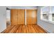 Bedroom with natural lighting, hardwood flooring, and closet at 1330 N Gibson Ave, Indianapolis, IN 46219