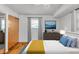 Serene bedroom featuring natural light, neutral tones, a spacious closet, and contemporary furnishings for a tranquil retreat at 1330 N Gibson Ave, Indianapolis, IN 46219
