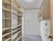 Spacious walk-in closet features shelving for storage at 1330 N Gibson Ave, Indianapolis, IN 46219