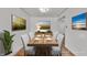 Well-lit dining room featuring modern furnishings, light-colored walls, wood floors, and stylish decor at 1330 N Gibson Ave, Indianapolis, IN 46219