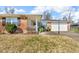 Charming home with brick facade, well-maintained lawn, and a covered front porch entrance at 1330 N Gibson Ave, Indianapolis, IN 46219