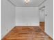 Living room featuring hardwood floors and ceiling light at 1330 N Gibson Ave, Indianapolis, IN 46219