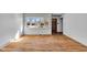 Bright living room featuring hardwood floors and a large window at 1330 N Gibson Ave, Indianapolis, IN 46219