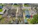 A high angle aerial view shows the home and neighborhood in early spring at 136 W 43Rd St, Indianapolis, IN 46208