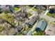 A high angle aerial view shows the home and neighborhood in early spring at 136 W 43Rd St, Indianapolis, IN 46208