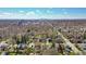 A high angle aerial view of the neighborhood with the downtown skyline in the distance at 136 W 43Rd St, Indianapolis, IN 46208