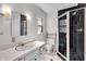 Updated bathroom with a modern shower, vanity with sink, and classic black and white tiles at 136 W 43Rd St, Indianapolis, IN 46208