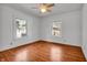 Bright bedroom with hardwood floors and dual windows offering plenty of natural light at 136 W 43Rd St, Indianapolis, IN 46208