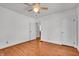 Spacious bedroom featuring original hardwood floors, neutral walls, and ample natural light from the window at 136 W 43Rd St, Indianapolis, IN 46208