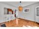 Bright dining area with hardwood floors, breakfast bar, and adjacent kitchen at 136 W 43Rd St, Indianapolis, IN 46208