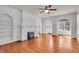 Spacious living room boasting hardwood floors, a fireplace, and built-in shelving at 136 W 43Rd St, Indianapolis, IN 46208