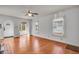 Well-lit living room with hardwood floors, arched doorways, and large windows at 136 W 43Rd St, Indianapolis, IN 46208