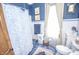 Charming bathroom features a blue and white color scheme and antique-style fixtures at 1542 Maple Ave, Noblesville, IN 46060