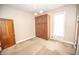 Spacious bedroom features a built-in wardrobe and a window for natural light at 1542 Maple Ave, Noblesville, IN 46060