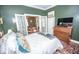 Lovely bedroom featuring a closet, an accent wall, and access through French doors to the living room at 1542 Maple Ave, Noblesville, IN 46060
