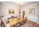 Well-lit dining room with a large table, seating for eight, and traditional decor at 1542 Maple Ave, Noblesville, IN 46060