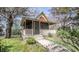 Charming home featuring a covered front porch, complemented by a well-maintained lawn and mature shade trees at 1542 Maple Ave, Noblesville, IN 46060