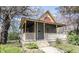 Charming home featuring a welcoming front porch, complemented by mature trees and landscaping at 1542 Maple Ave, Noblesville, IN 46060