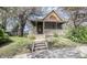 Charming home featuring a covered front porch, complemented by a well-maintained lawn and mature shade trees at 1542 Maple Ave, Noblesville, IN 46060