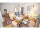 Charming office showcasing hardwood floors, vintage desk, and a view into the living room, providing comfort at 1542 Maple Ave, Noblesville, IN 46060