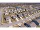 Extensive aerial view showcasing a residential area with mature trees and diverse housing at 16566 Branham Dr, Fishers, IN 46040