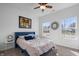 Bright bedroom with large windows, neutral walls and flooring, and a blue accent bed at 16566 Branham Dr, Fishers, IN 46040