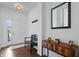 Inviting entryway features a wooden bench, console table, and a decoratively framed mirror at 16566 Branham Dr, Fishers, IN 46040