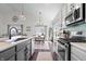 View of the kitchen with stainless steel appliances and a connected dining area at 16566 Branham Dr, Fishers, IN 46040