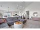 Open concept living room and kitchen area with vaulted ceilings and stylish modern decor at 16566 Branham Dr, Fishers, IN 46040