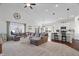 Open concept living room and kitchen area with vaulted ceilings and stylish modern decor at 16566 Branham Dr, Fishers, IN 46040