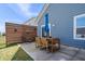 Outdoor patio with a wooden dining set and a modern privacy screen at 16566 Branham Dr, Fishers, IN 46040