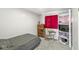 Bedroom features a bed, desk, and shelving for ample storage at 1710 Bittersweet Dr, Anderson, IN 46011
